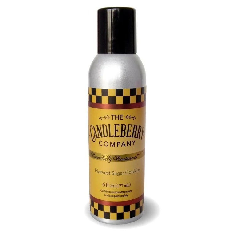 A room spray bottle with a black lid and a label that has a yellow checkered design and text reading 'Candleberry Company Harvest Sugar Cookie'.