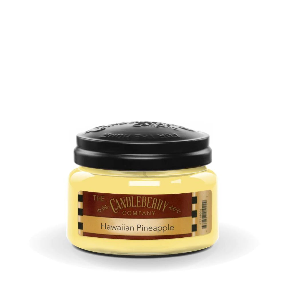 A small jar of Candleberry brand candle with a Hawaiian Pineapple label, indicating a soy wax blend and a single wick.