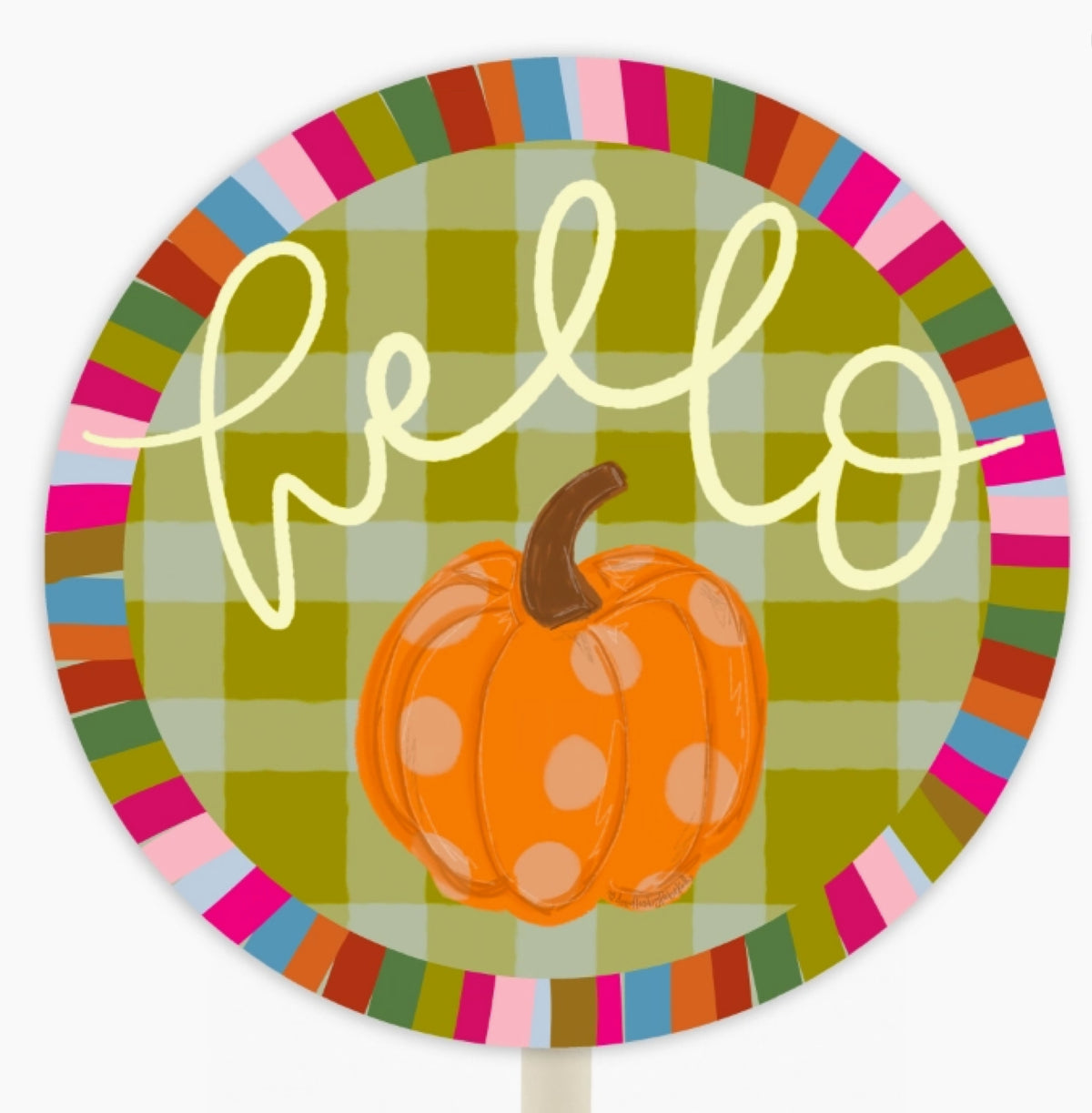 A round autumn-themed sign or decoration featuring the word 'hello' in cream script over a green plaid background, with an orange pumpkin in the center and a multicolored striped border around the edge.