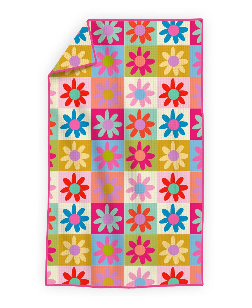 Colorful quilt with floral pattern on a white background