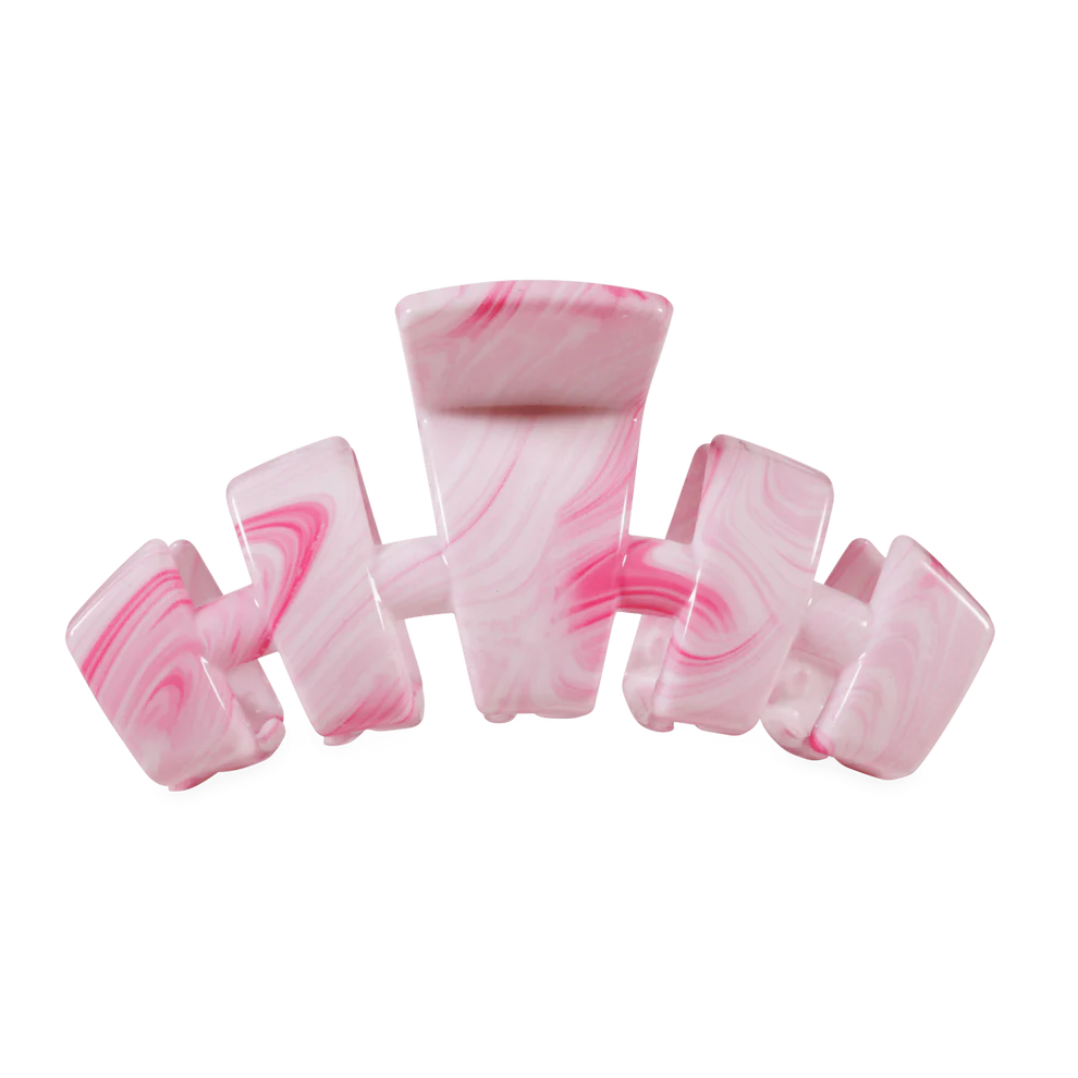 Pink and white marbled claw clip on a white background