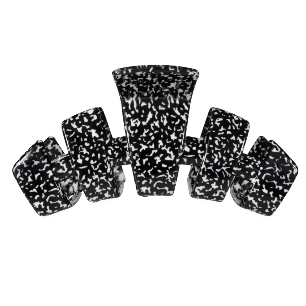 A set of six black and white marbled claw clip