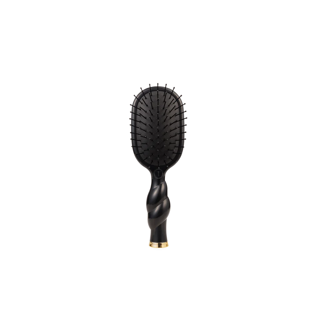 Black hairbrush with a twisted handle on a white background