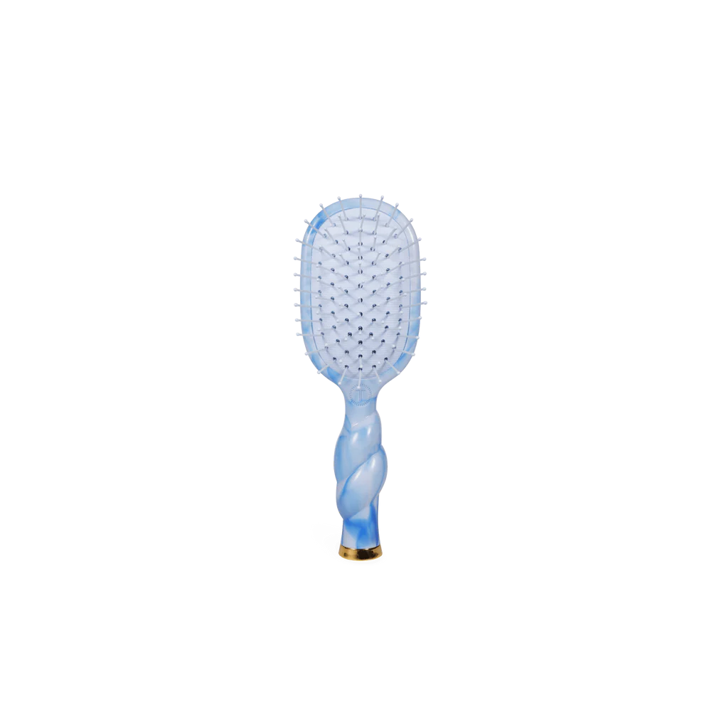 Blue paddle hairbrush on a white background