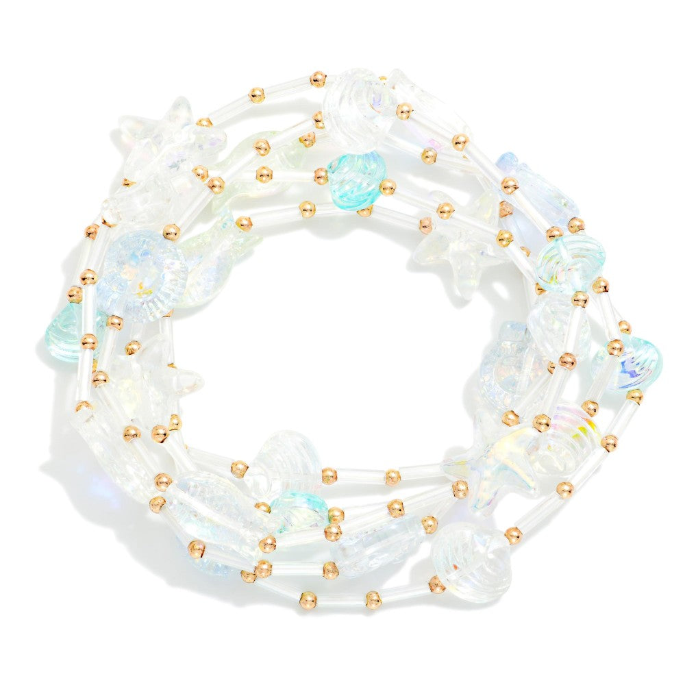 Iridescent and gold Tube and bead bracelet set on a white background 