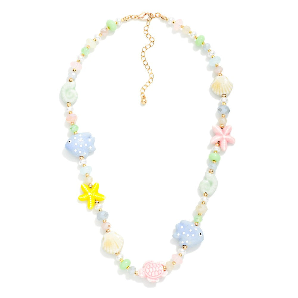 Beaded Necklace Featuring Nautical Beads & Pearls on a white background 

