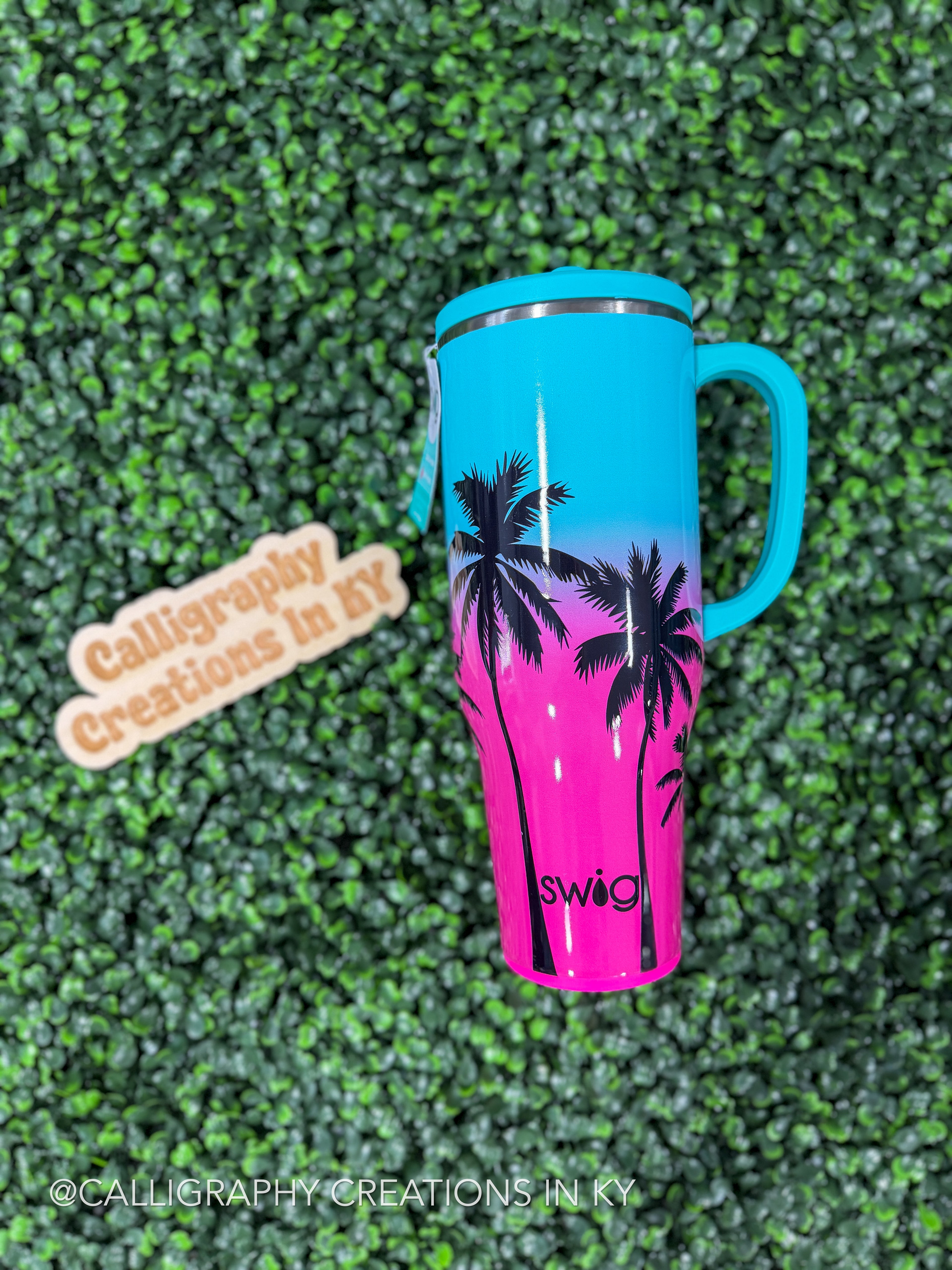 Gradient mug with palm tree design on a green textured background