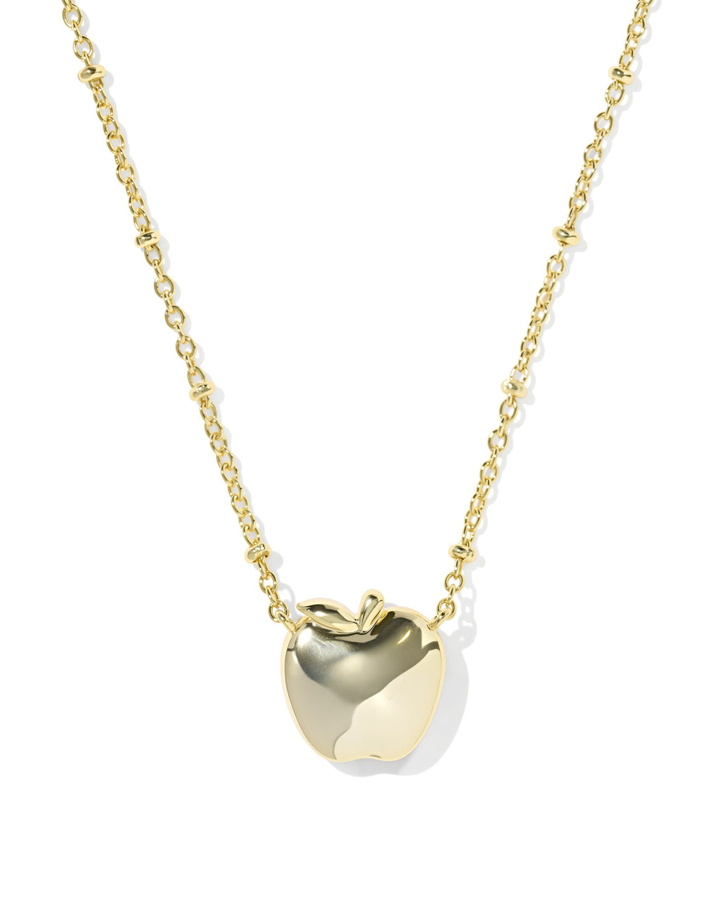 Gold apple-shaped pendant necklace on a white background