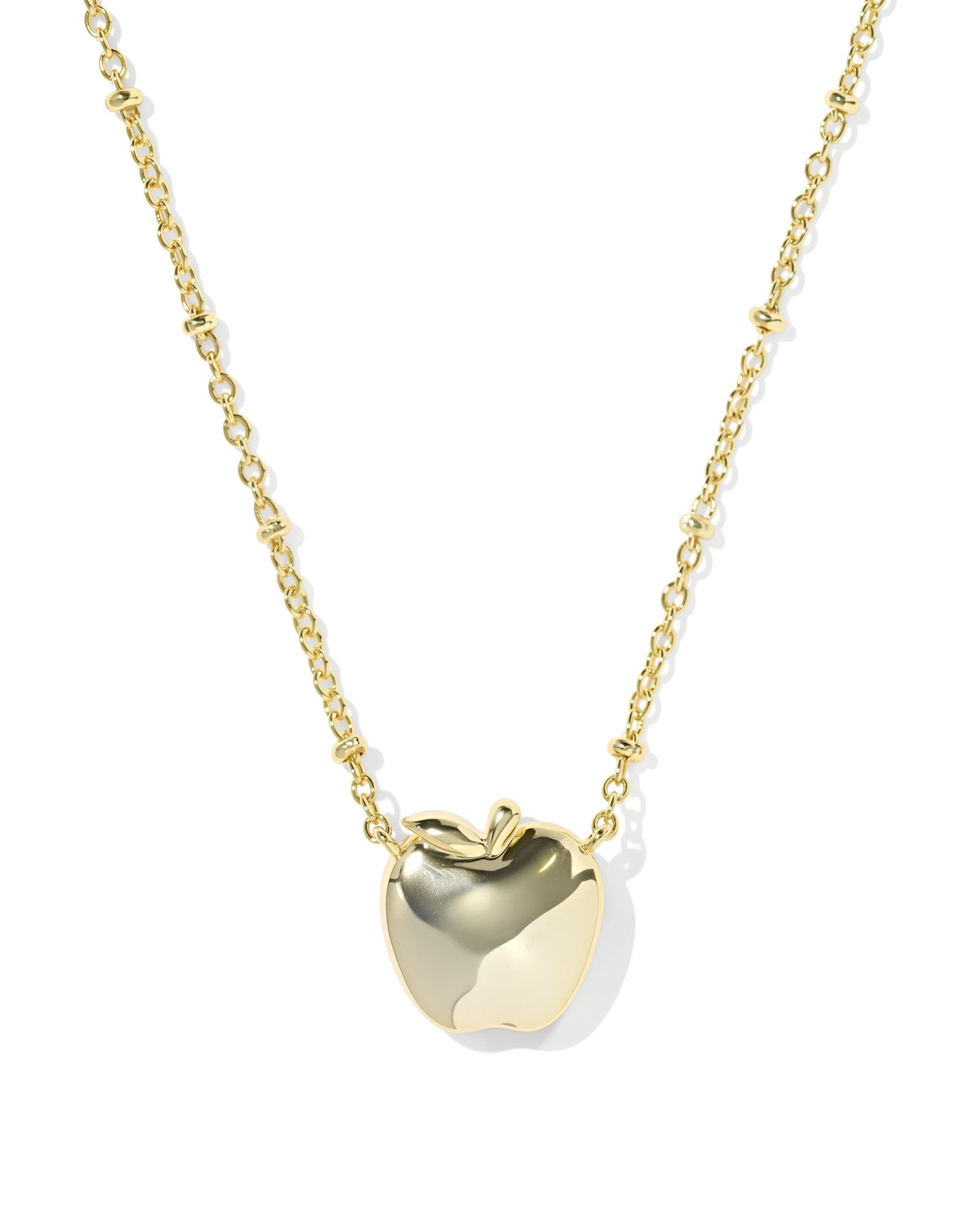 Gold apple-shaped pendant necklace on a white background