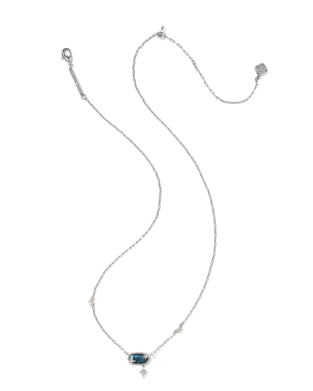 A delicate silver chain necklace featuring a small rectangular blue gemstone pendant, accented with tiny pavé-set clear stones, shown on a plain white background.