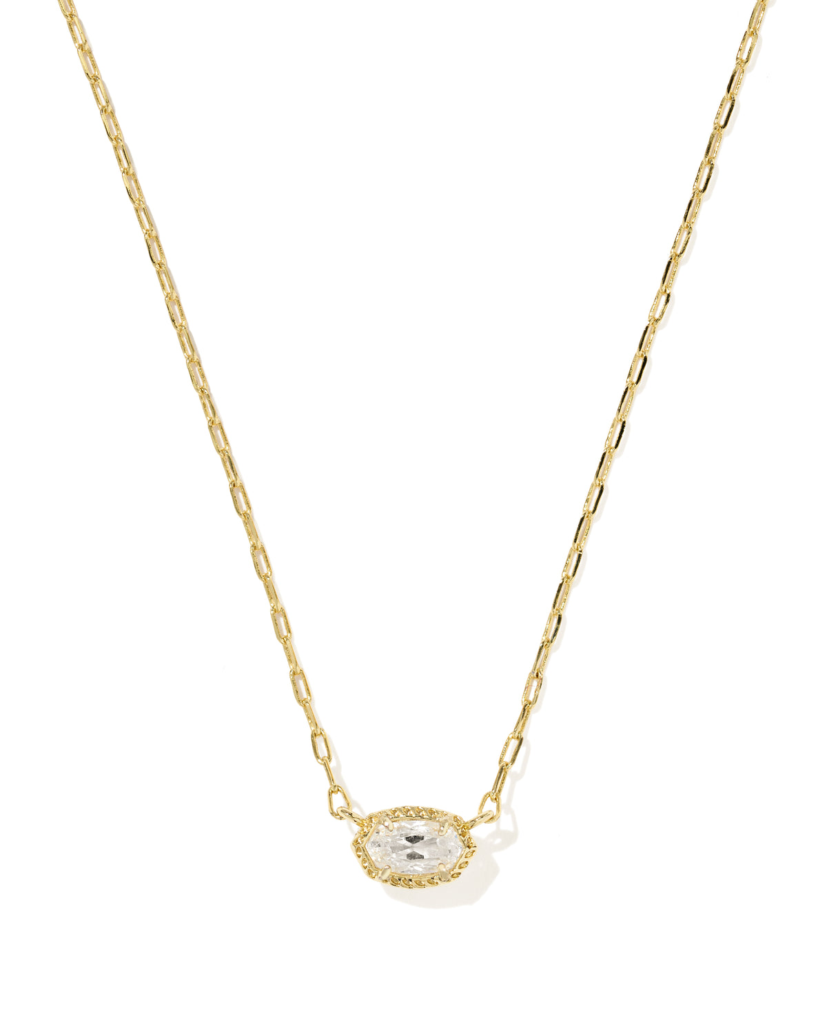 A delicate gold chain necklace featuring an oval pendant with a clear central gemstone surrounded by a halo of small clear stones, set against a plain white background.