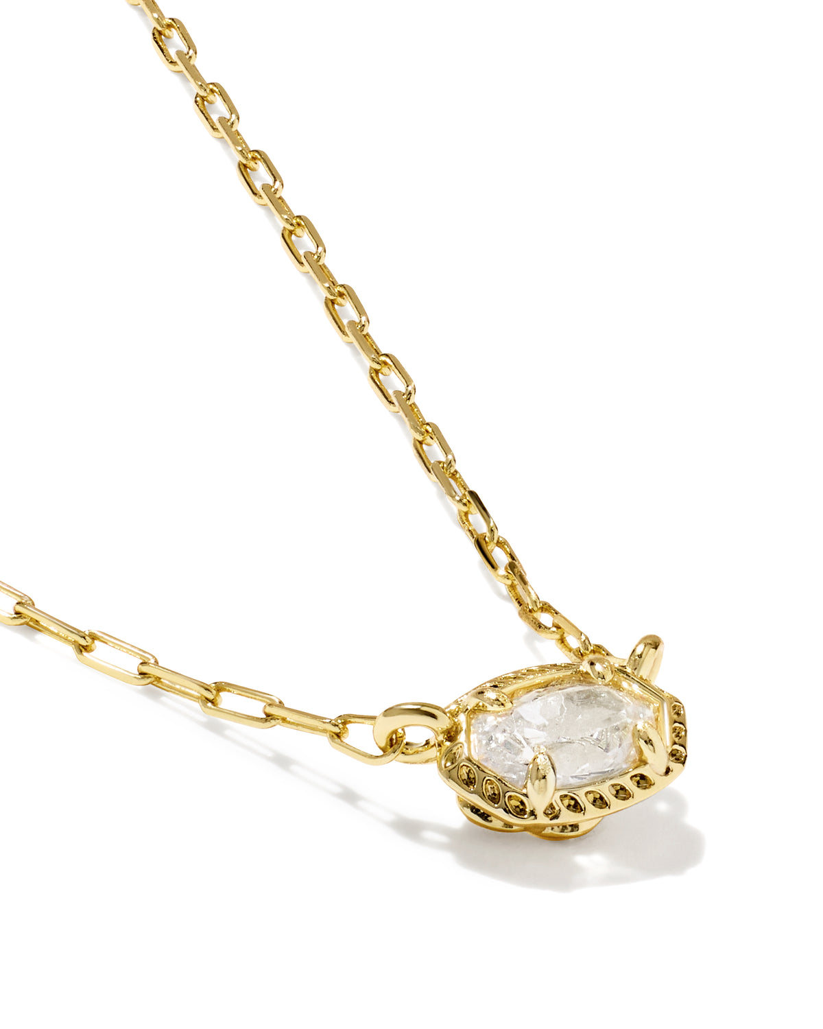 A gold chain necklace with a unique pavé-set clear gemstone pendant, photographed on a clean white background.