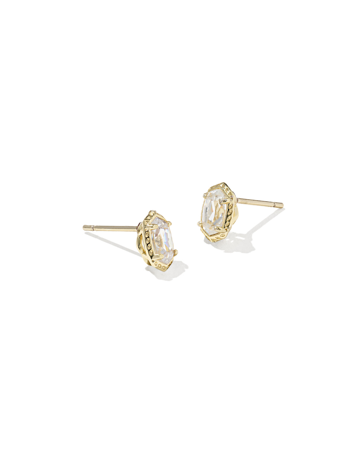 Teardrop-shaped earrings with black stones on a white background with measurement scale.