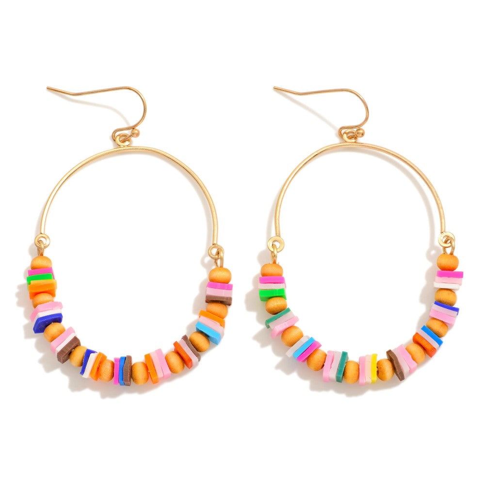 Colorful beaded hoop earrings on a white background