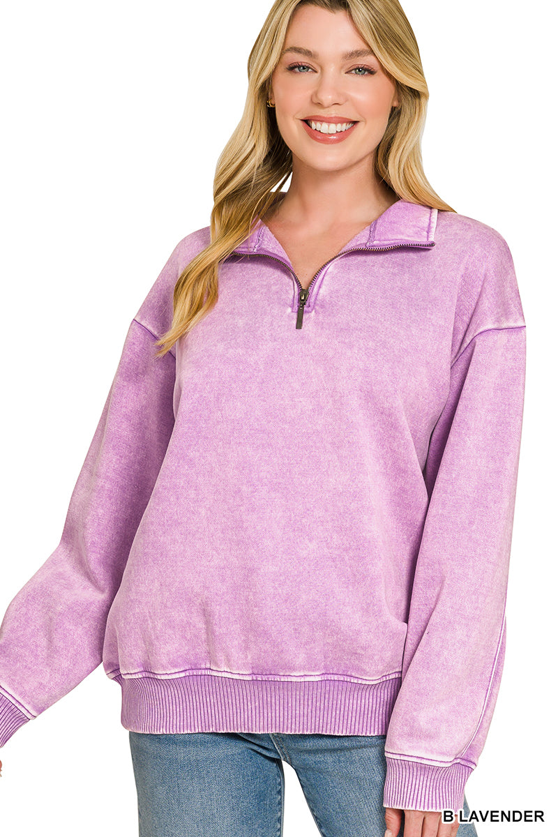 Woman wearing a purple pullover with a white background