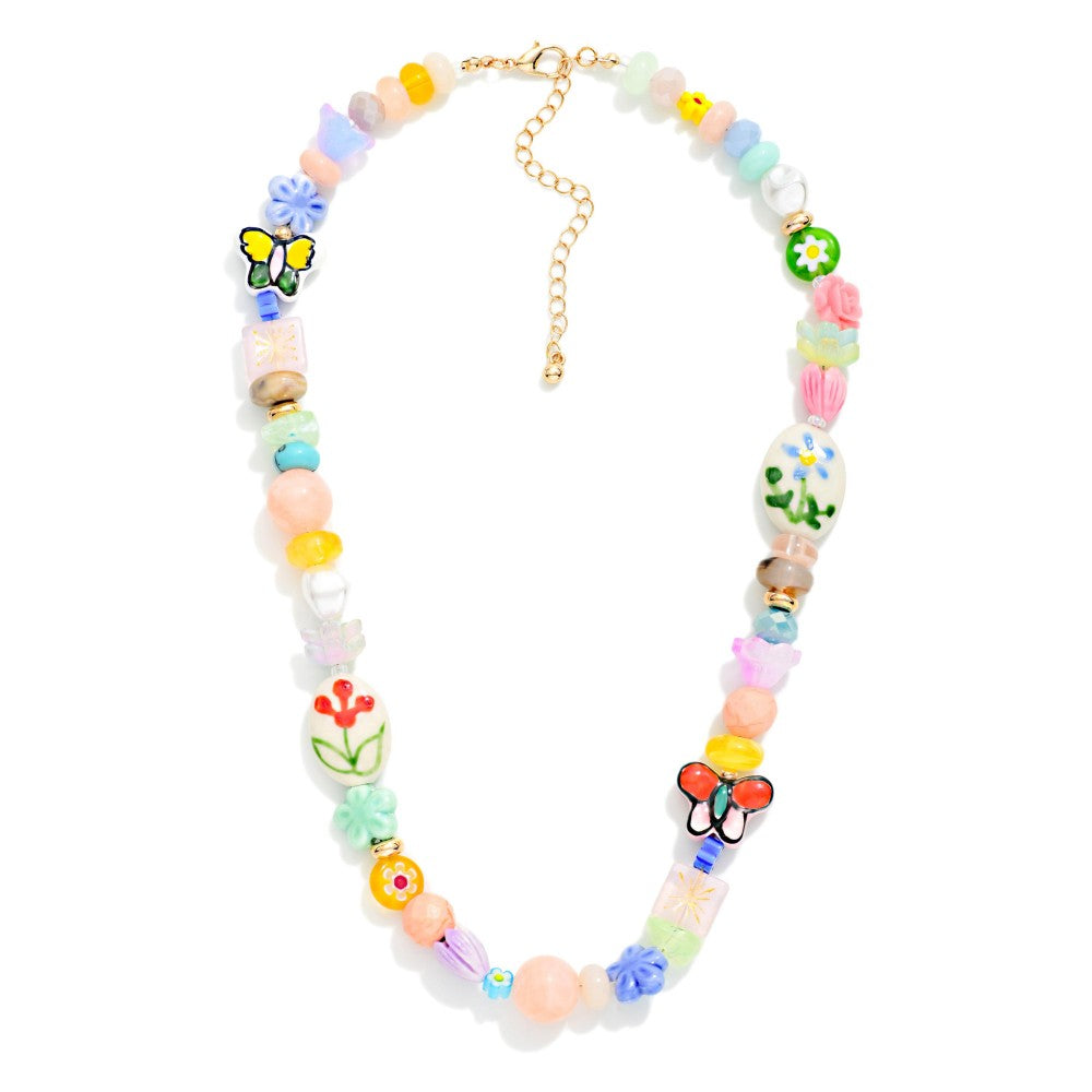Multi Bead Beaded Necklace Featuring Flowers & Porcelain Beads On a white background 
