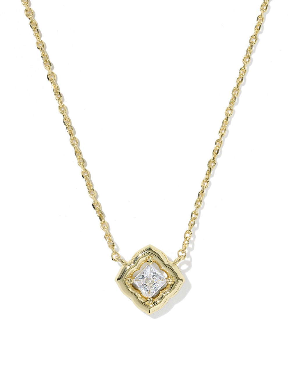 Gold necklace with a diamond pendant on a white background