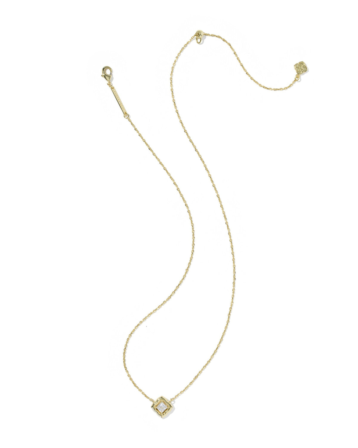 Gold necklace with a small pendant on a white background