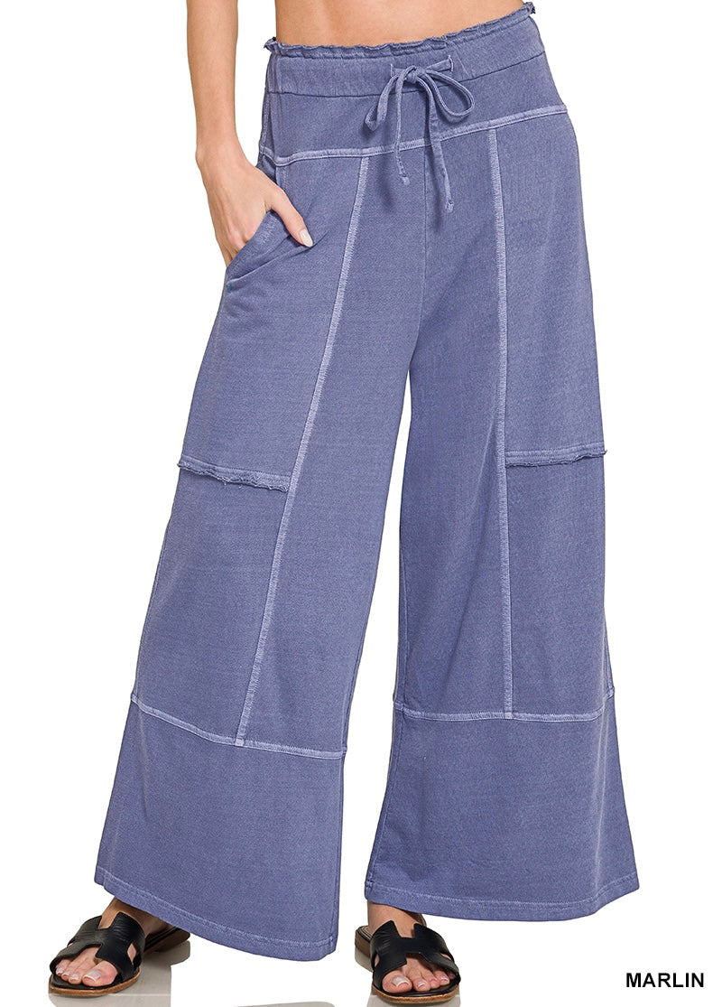 Dark blue wide leg pants on a white background