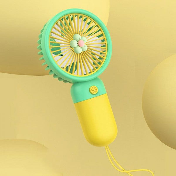 Green and yellow handheld fan on a yellow background