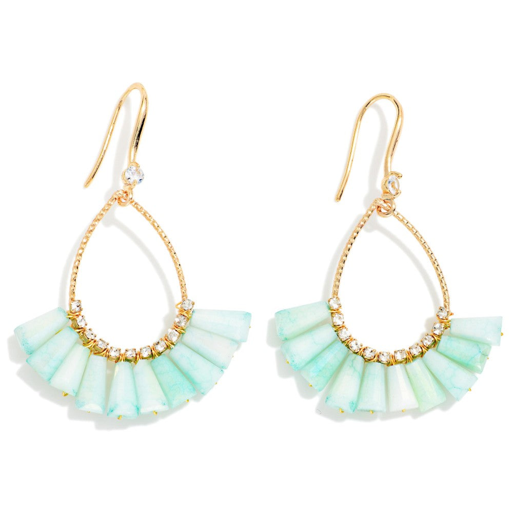 A pair of gold-tone drop earrings featuring a teardrop-shaped gold frame with a tiered fan of pale mint green beads and small clear rhinestone accents, shown on a white background.