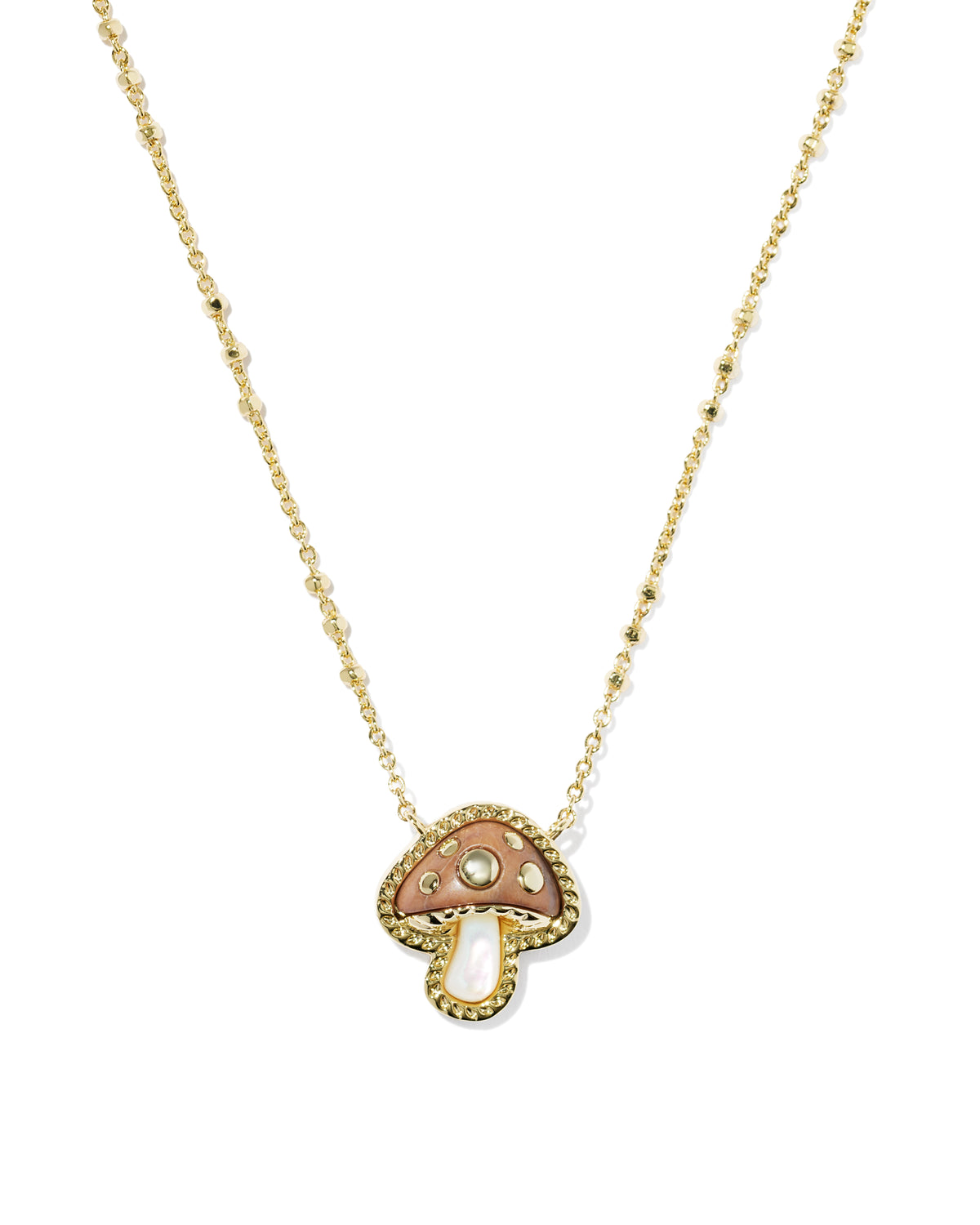 A gold chain necklace featuring a mushroom-shaped pendant with a textured gold border, a pinkish-brown enamel cap, a small white pearl, and a central clear rhinestone, shown on a plain white background.