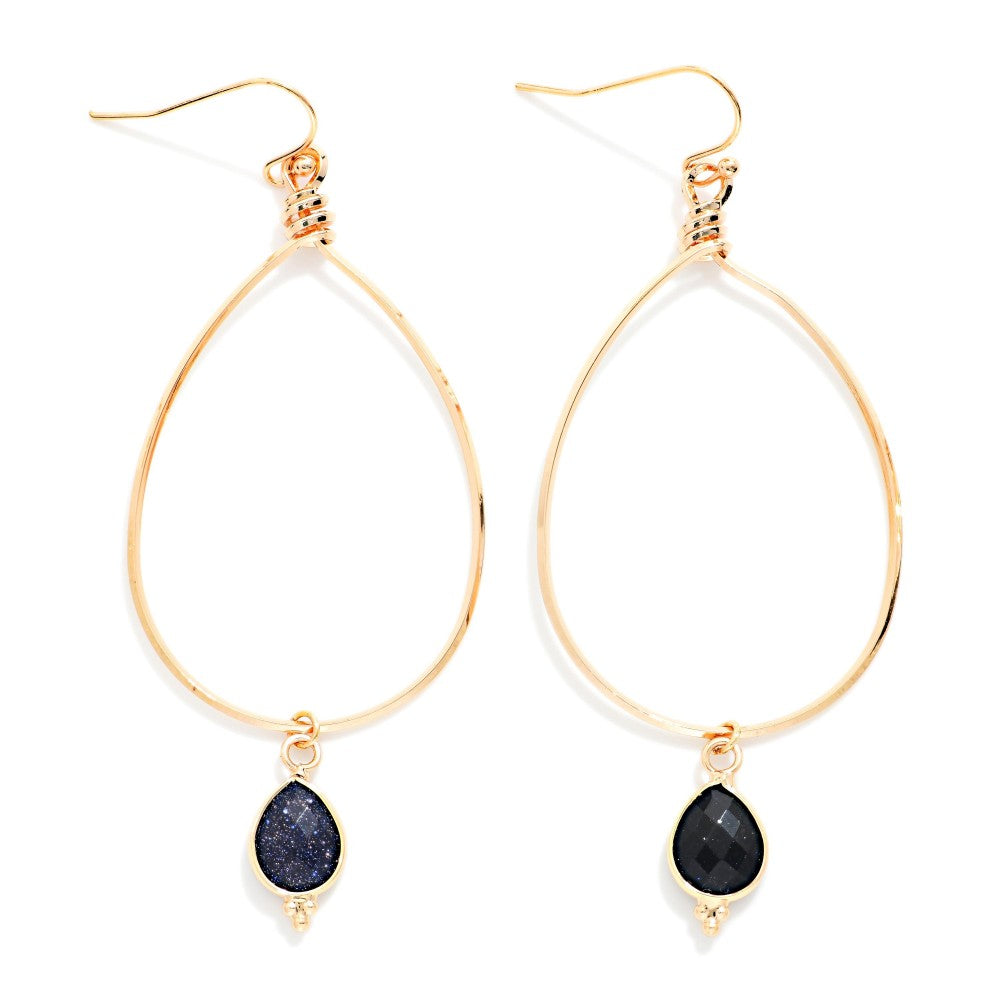 Metal Tone Wire Teardrop Drop Earrings With navy faceted Stone Teardrop Detail on a white background 
