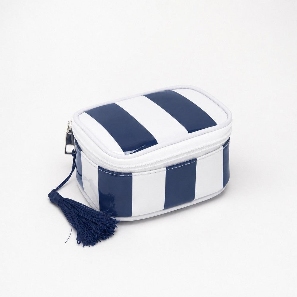 Small rectangular pouch with navy and white stripes and a tassel on a light gray background