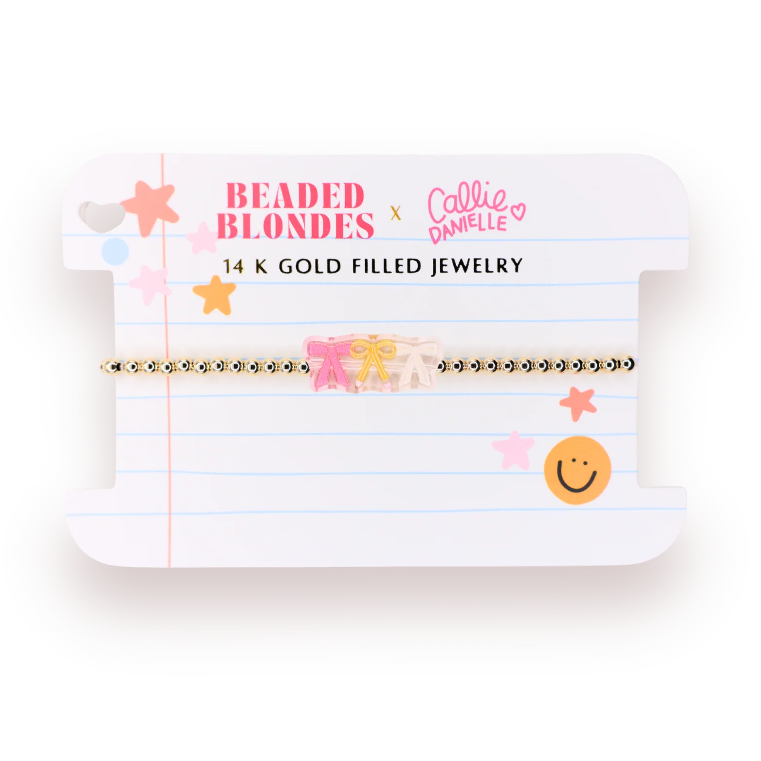 A 14K gold filled beaded bracelet featuring a pink bow and a small beige floral charm, presented on a white lined card with 'Beaded Blondes x Callie Danielle' branding.