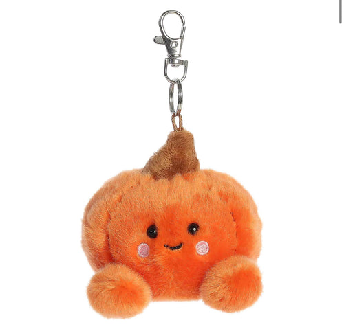 A cute orange plush pumpkin keychain with a smiling face, embroidered eyes, pink cheeks, and a brown stem, attached to a silver metal lobster clasp on a plain white background.