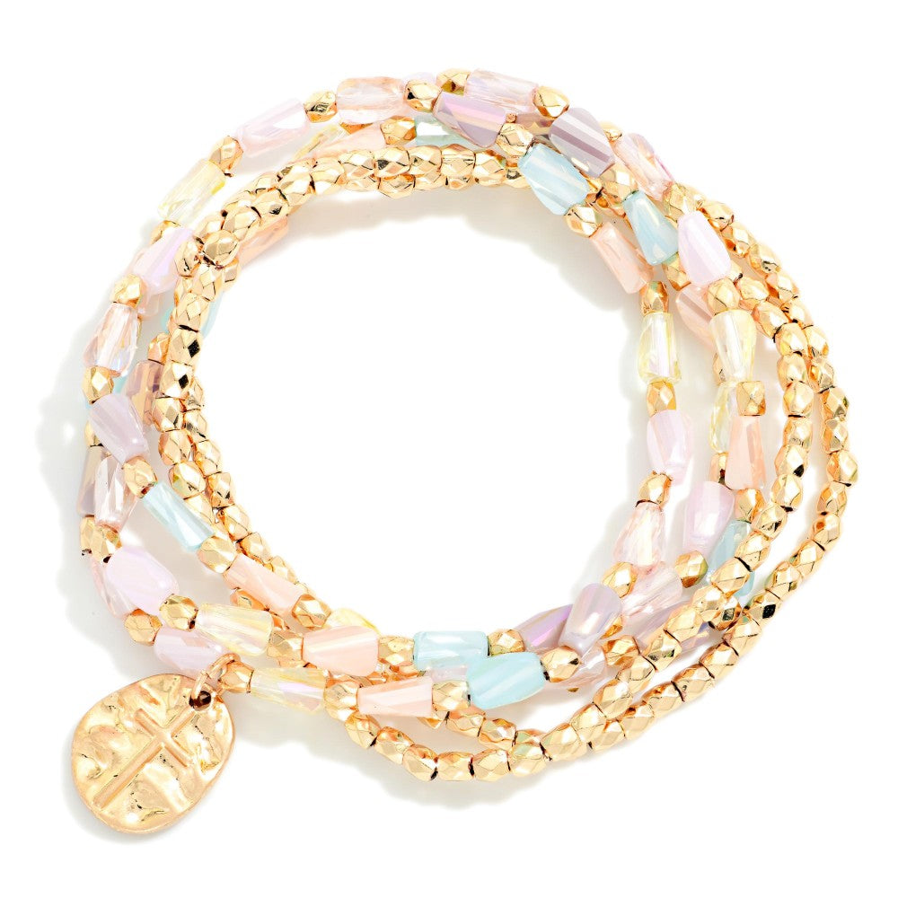 Pastel and gold beaded bracelet set on a white background