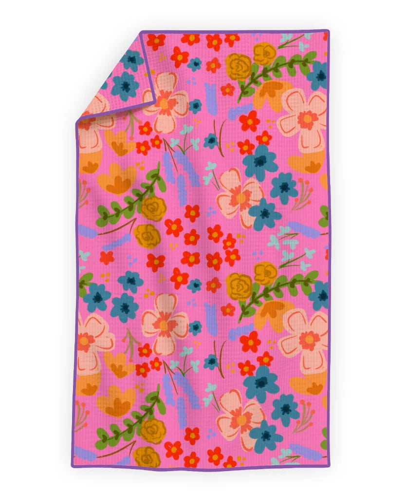 Floral patterned towel on a pink background