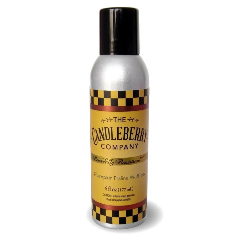 A can of Candleberry room spray with a label that has a black and yellow checkered pattern and text that reads 'Pumpkin Praline Waffles'. The can is silver with a black lid.