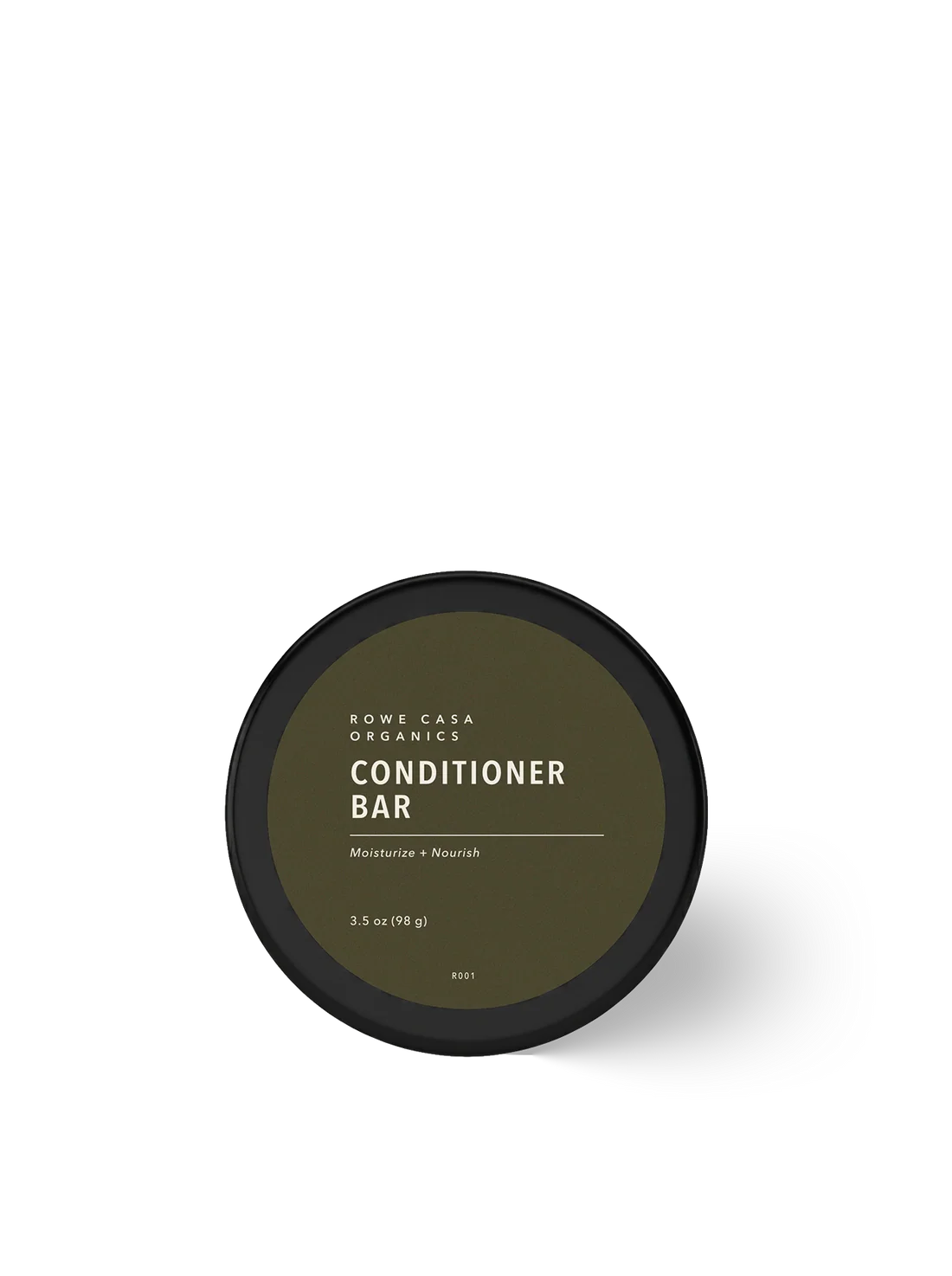 A round black container of Rowe Casa Organics Conditioner Bar, featuring a dark olive green label with white text, set against a clean white background with a soft shadow.