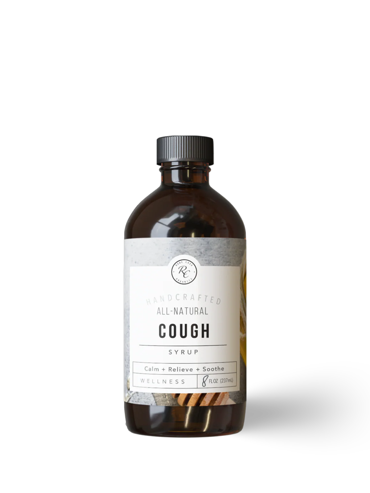 Bottle of all-natural cough syrup on a white background