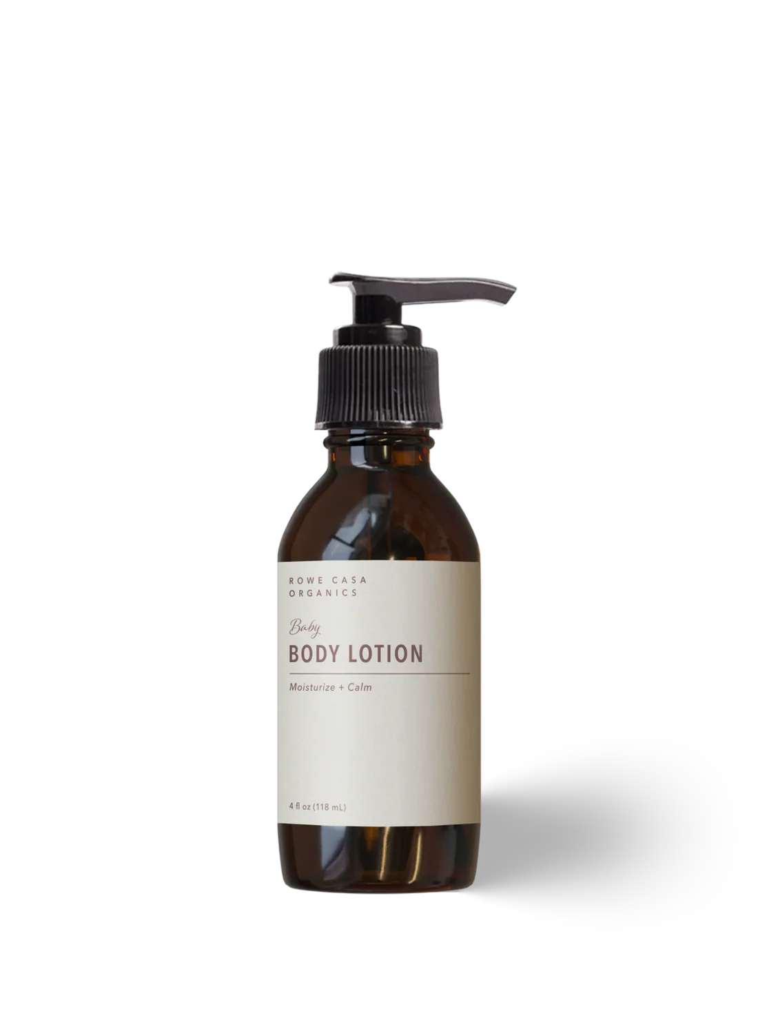 Rowe Casa Organics Body Lotion in an amber glass bottle with a black pump dispenser and a cream-colored label, shown on a white background with a soft shadow.