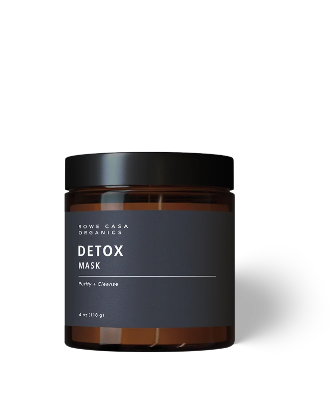 A jar of Rowe Casa Organics Detox Mask in an amber glass container with a black lid and a dark charcoal label, shown on a clean white background.