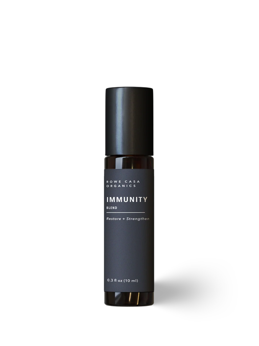 A bottle of Rowe Casa Organics Immunity Blend  on a clean white background. The bottle is dark amber glass with a matte black cap and a dark charcoal gray label featuring white text.