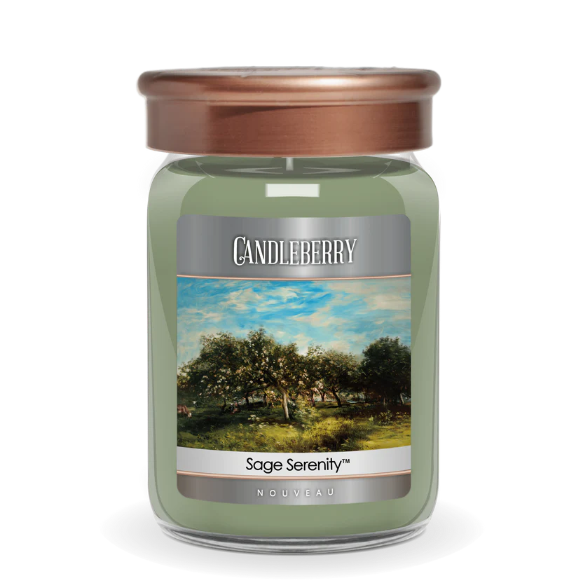 A green jar candle with a brown lid, labeled 'Sage Serenity' from Candleberry, depicting a serene landscape on the label.