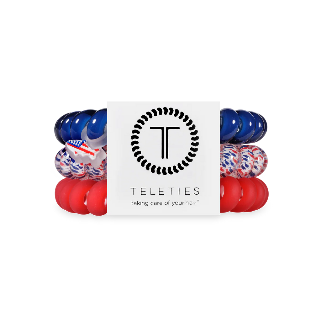 Set of red, blue, and white hair ties with 'Teleties' branding on a white background