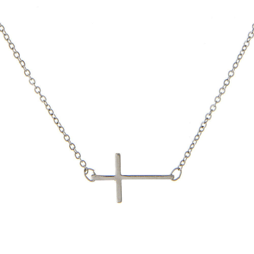 Silver cross necklace on a white background