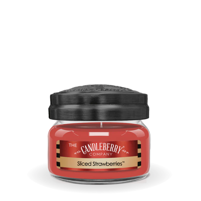 A small jar candle with a black lid, labeled 'Sliced Strawberries', from The Candleberry Company.