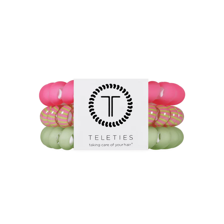 Set of 3 hair ties hat are green pink and striped. 
