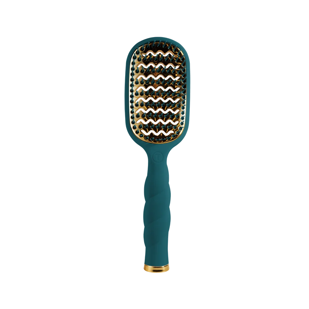 A paddle-style hairbrush with a textured teal handle and a metallic gold-and-black wavy bristle pattern, shown against a solid white background.