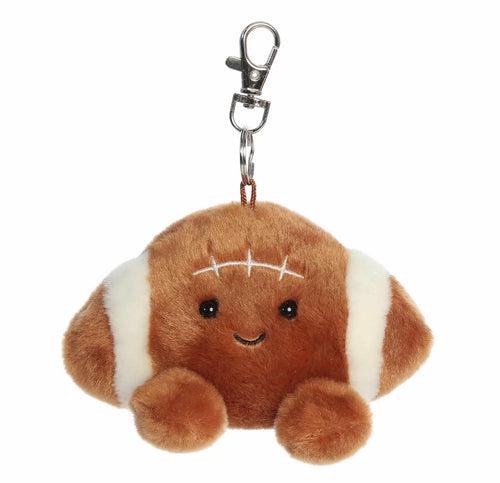 A cute, kawaii-style plush football keychain. The plush toy is brown with white stripes and embroidered facial features, attached to a silver metal lobster clasp.