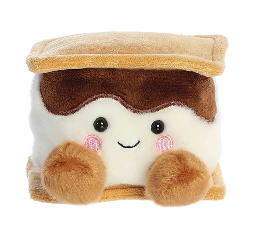 A cute plush toy designed to look like a toasted marshmallow or s'mores sandwich, featuring a white marshmallow body, brown frosting, a tan crust, and embroidered facial features on a solid white background.