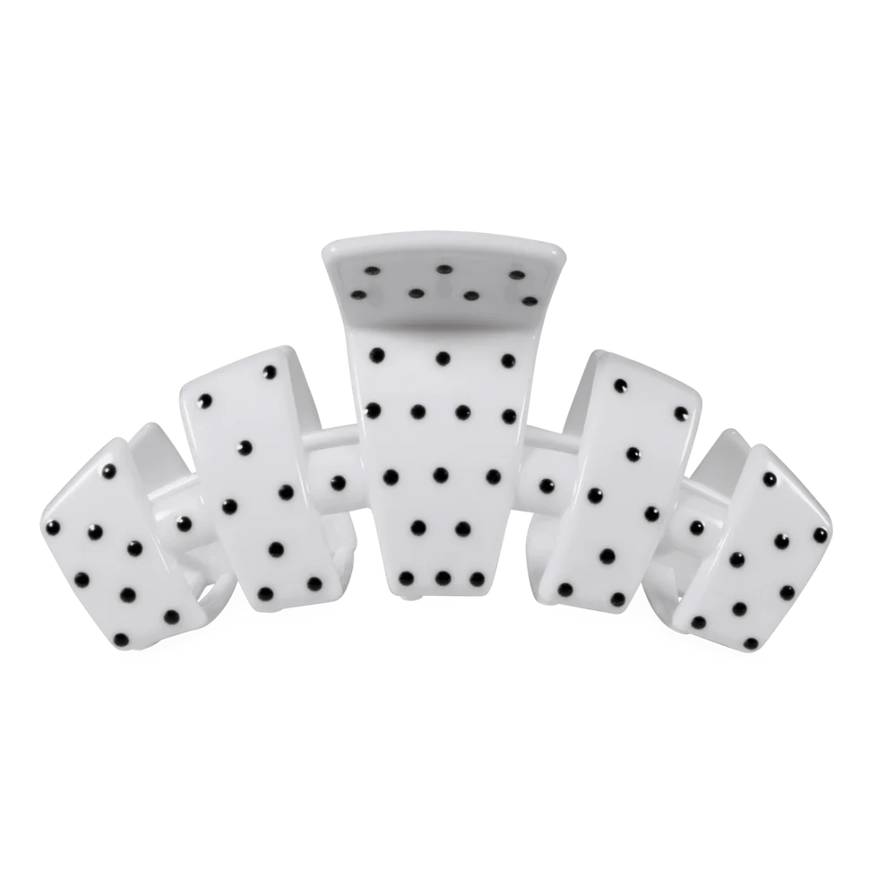A white hair claw clip designed to look like a set of dominoes, featuring black dot patterns on a clean white background.