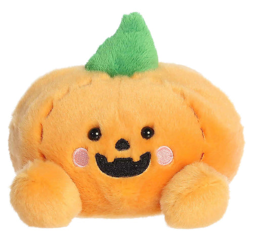 A cute, soft plush toy shaped like a smiling orange pumpkin with a green leaf on top, black embroidered eyes and mouth, and pink cheek details, shown against a plain white background.