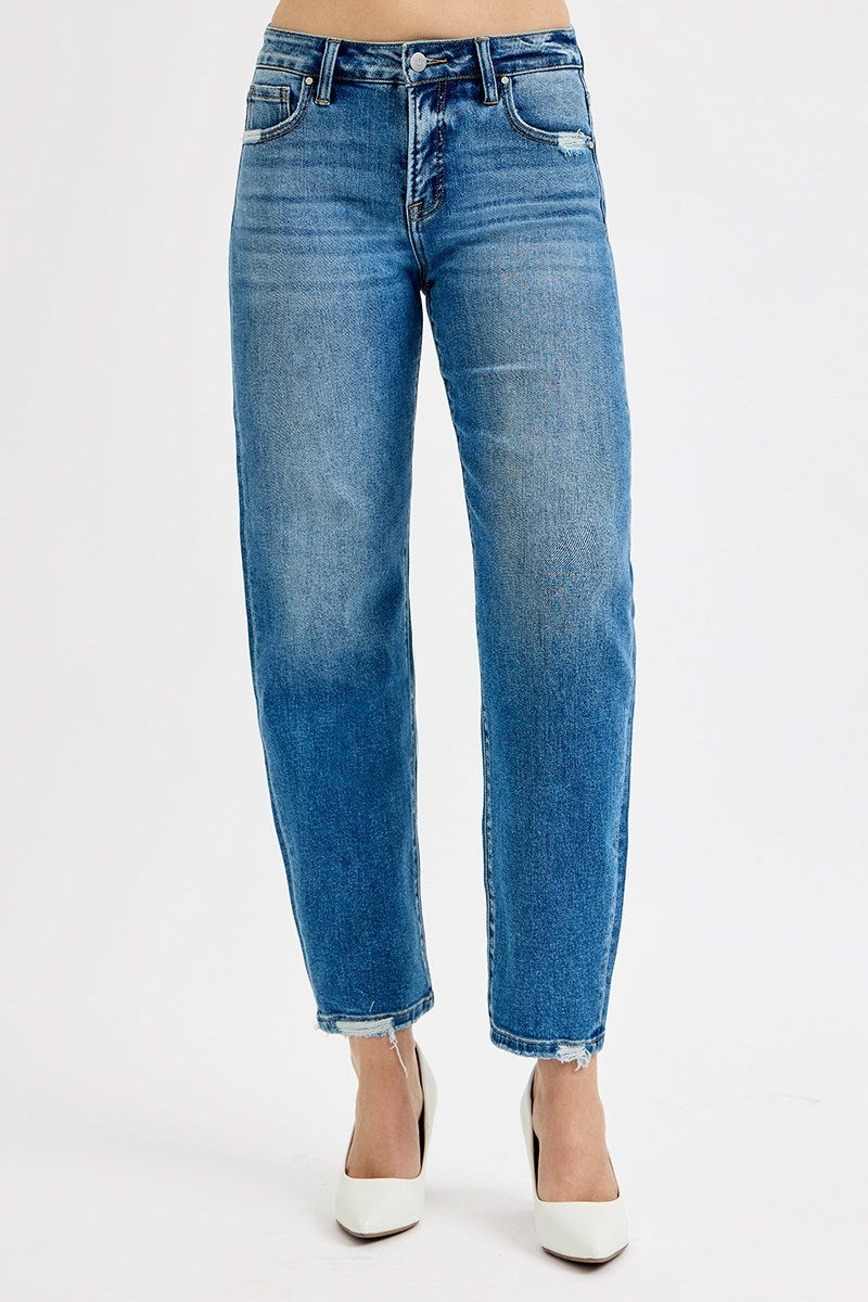 Blue jeans worn by a person on a white background