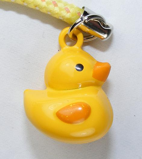 Yellow duck keychain on white background 